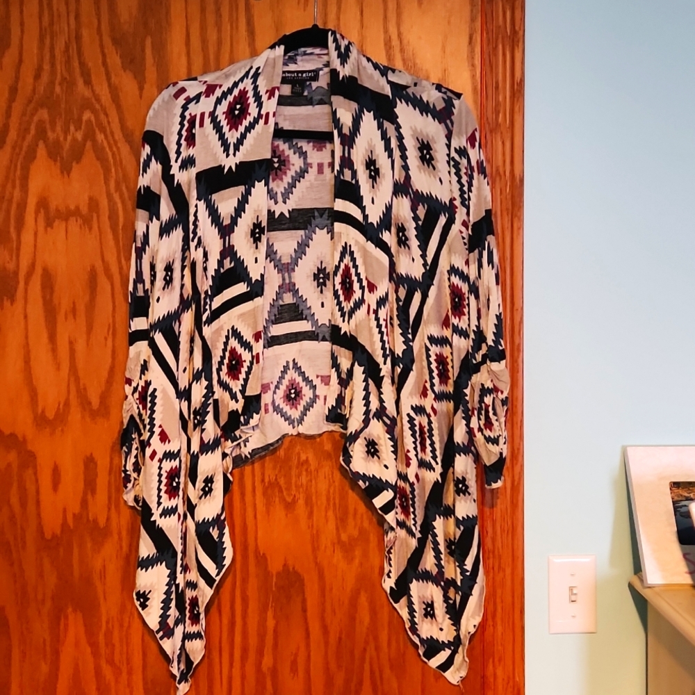 About A Girl cardigan,  size large with a print and a handkerchief hem in front.
